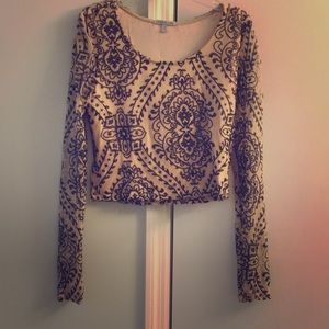 Long sleeve crop with (not shiny) sequin details.